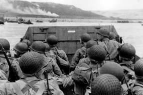 Vintage photgraph of World War 2 soldiers crowded on a landing craft