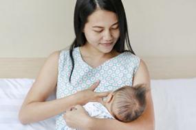 Mother breastfeeding an infant